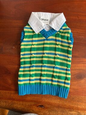 Cable knit, dog sweater vest with attached collar.